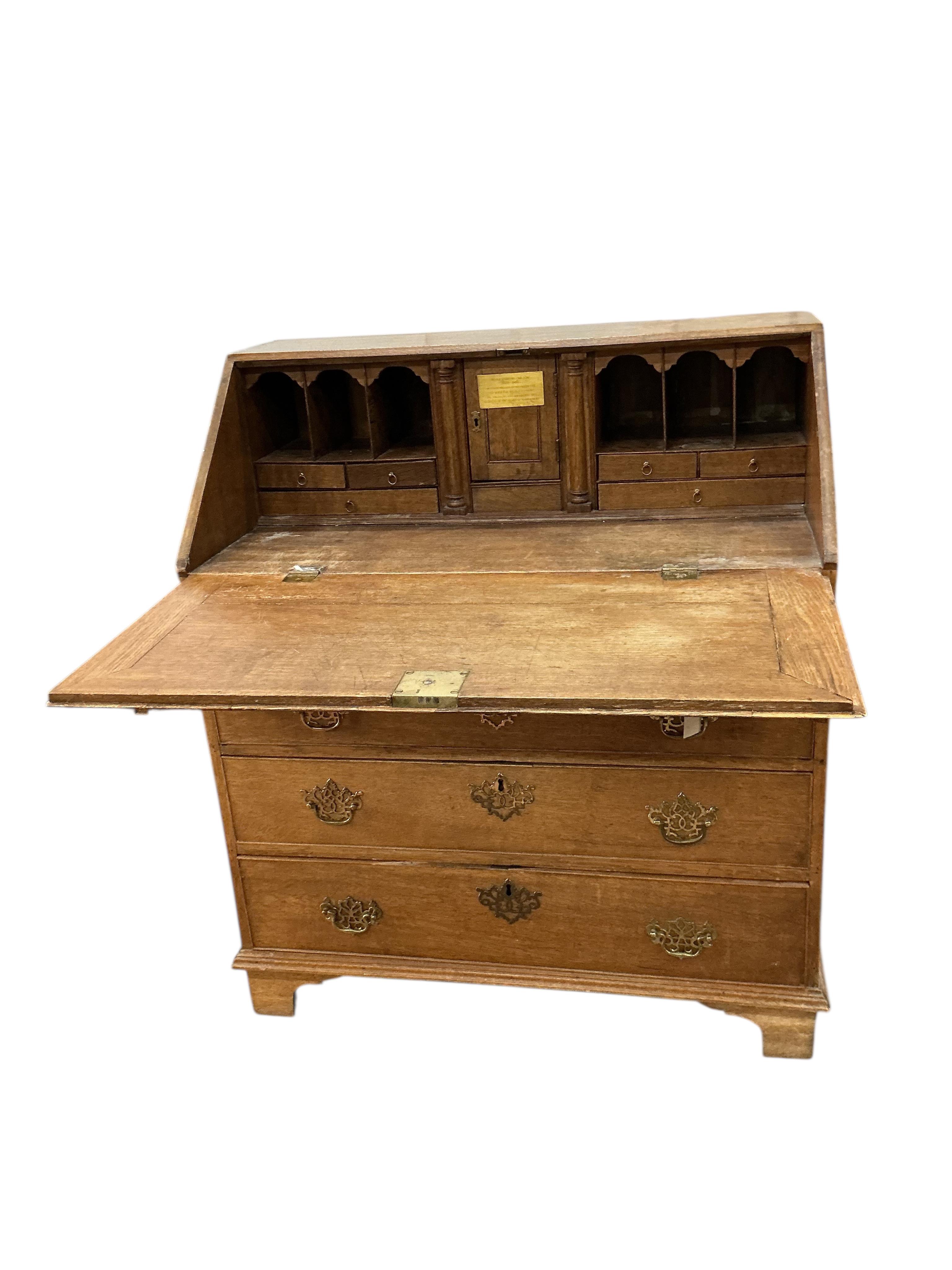 A George III oak bureau, width 91cm, depth 52cm, height 105cm